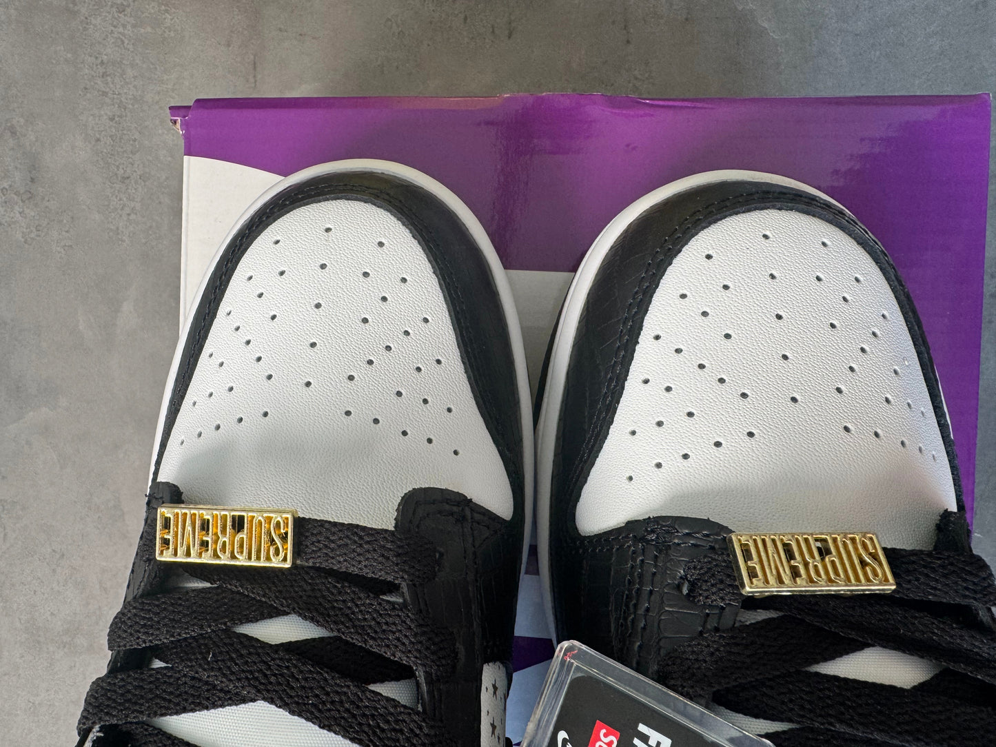 Supreme × Nike SB Dunk Low OG QS "Gold Stars" White/Black