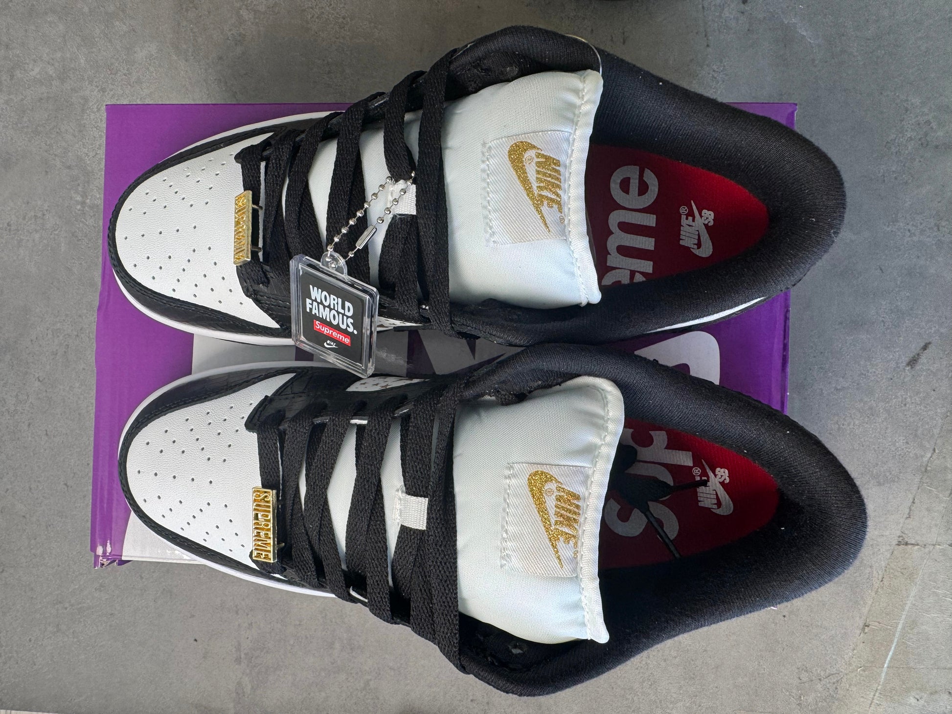 Supreme × Nike SB Dunk Low OG QS "Gold Stars" White/Black