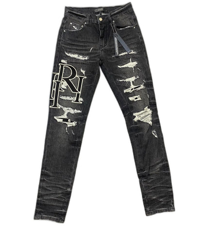 AMIRI jeans with a distressed finish, embroidered logo on the side