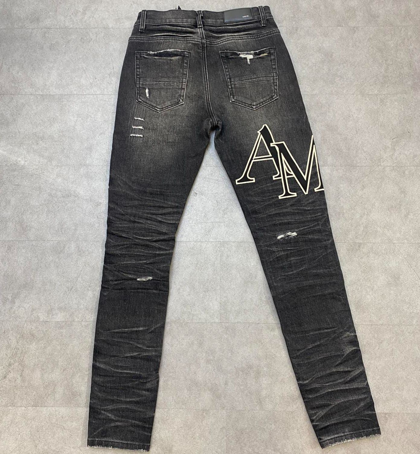 AMIRI jeans with a distressed finish, embroidered logo on the side