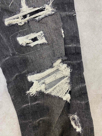 AMIRI jeans with a distressed finish, embroidered logo on the side