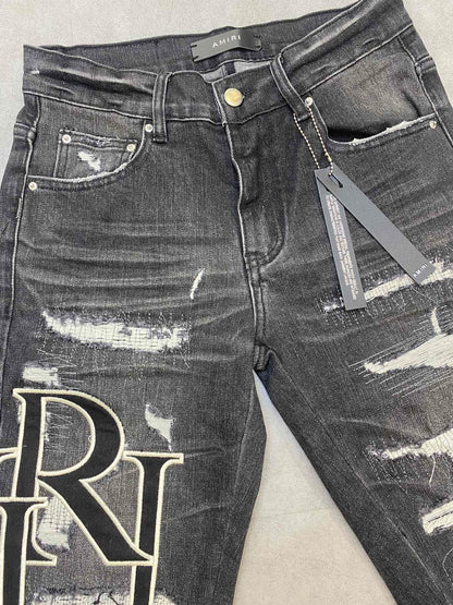 AMIRI jeans with a distressed finish, embroidered logo on the side