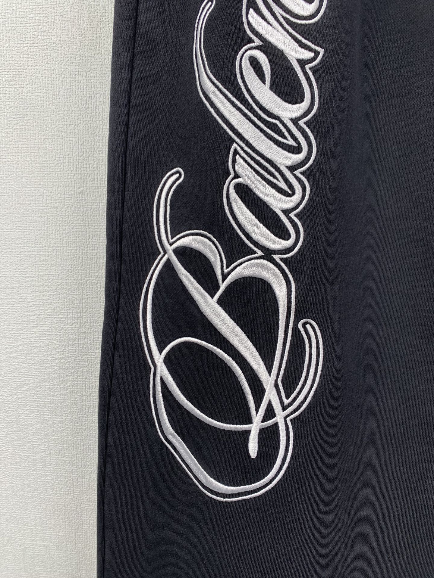 Balenciaga Cursive Baggy Pants for Men in Black/White