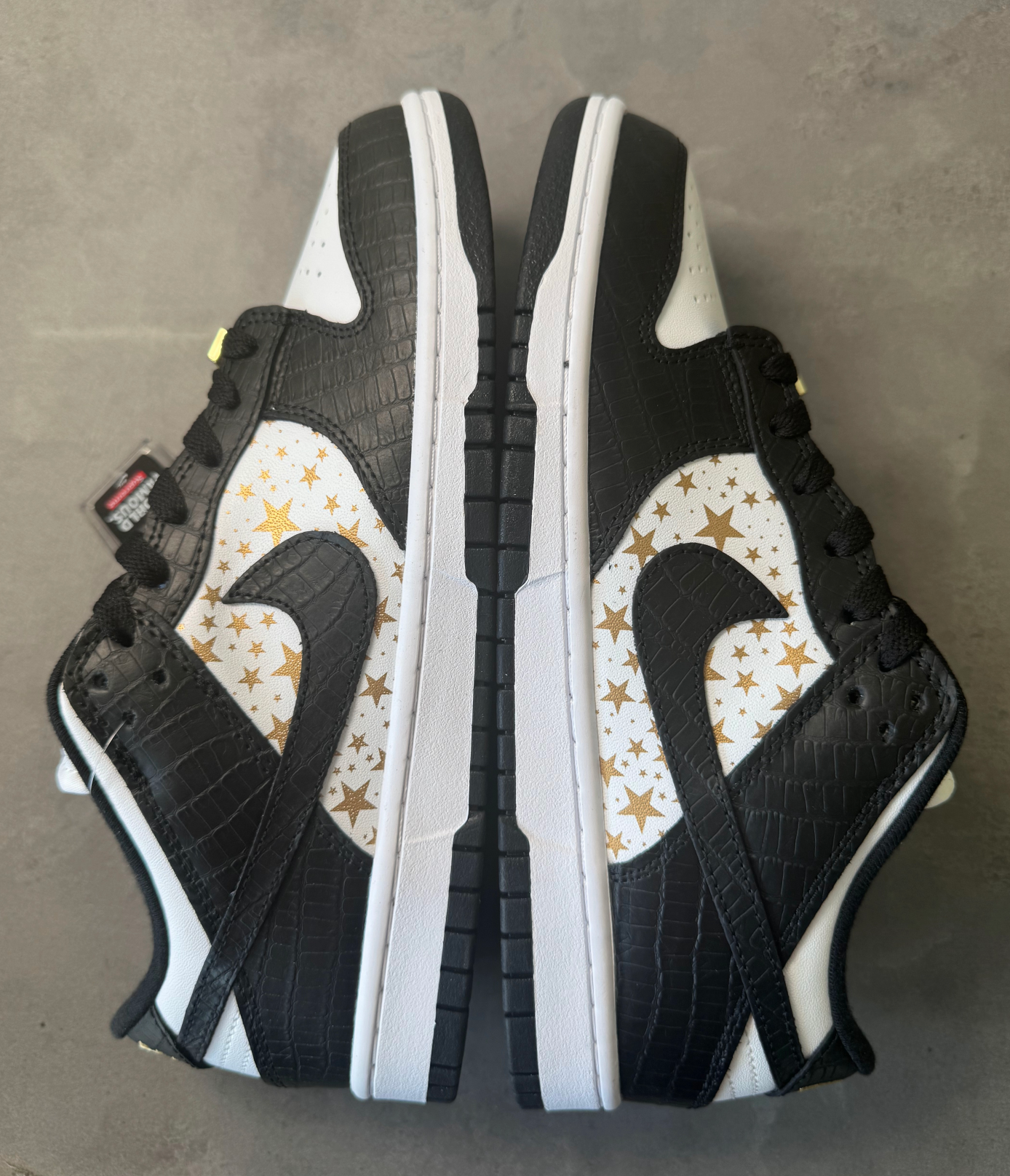 Supreme × Nike SB Dunk Low OG QS "Gold Stars" White/Black